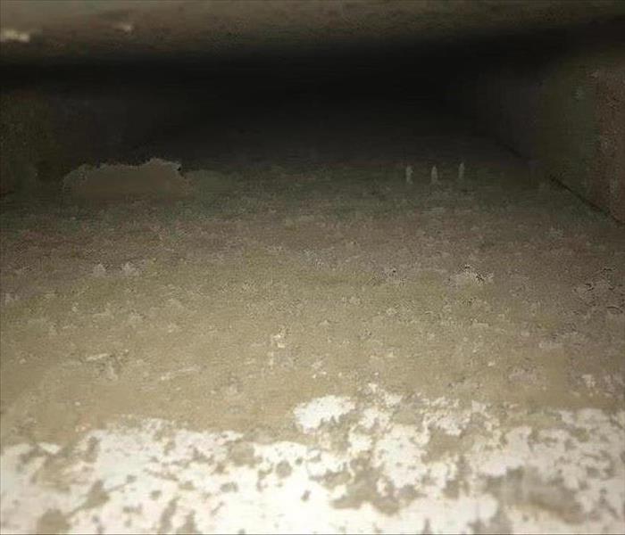 A vent is covered with dirt and grime