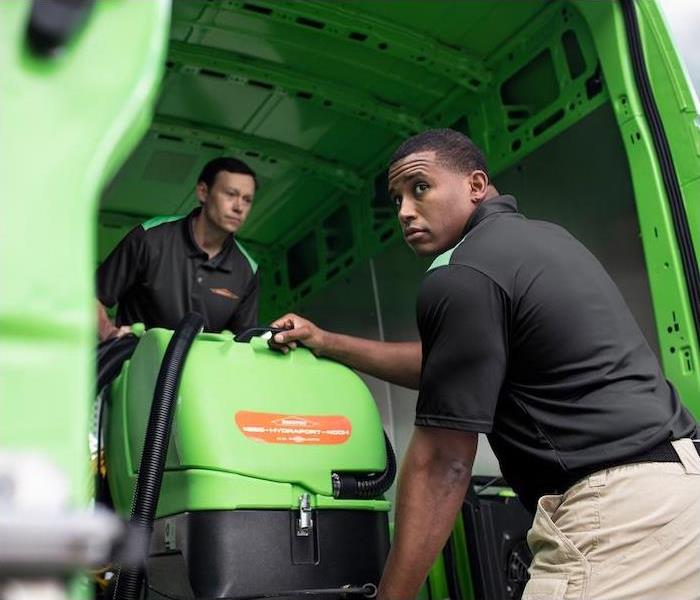 Two SERVPRO employees unloading equipment